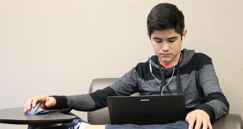 Kid working on a computer 