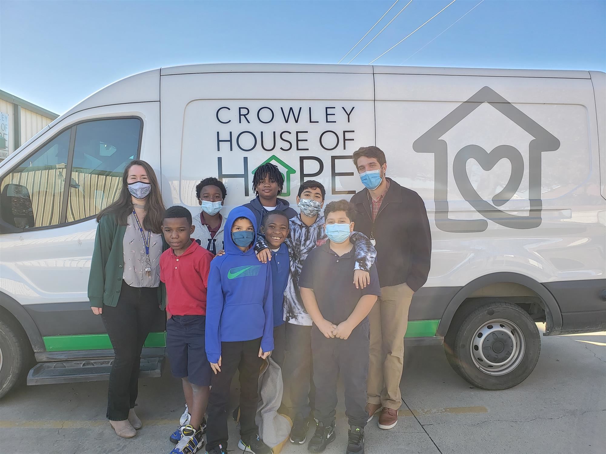 Sycamore Elementary students in front of a Crowley House of Hope Van