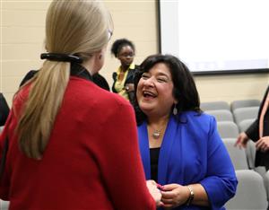 Dr. Linares shakes hands with CISD faculty and staff. 