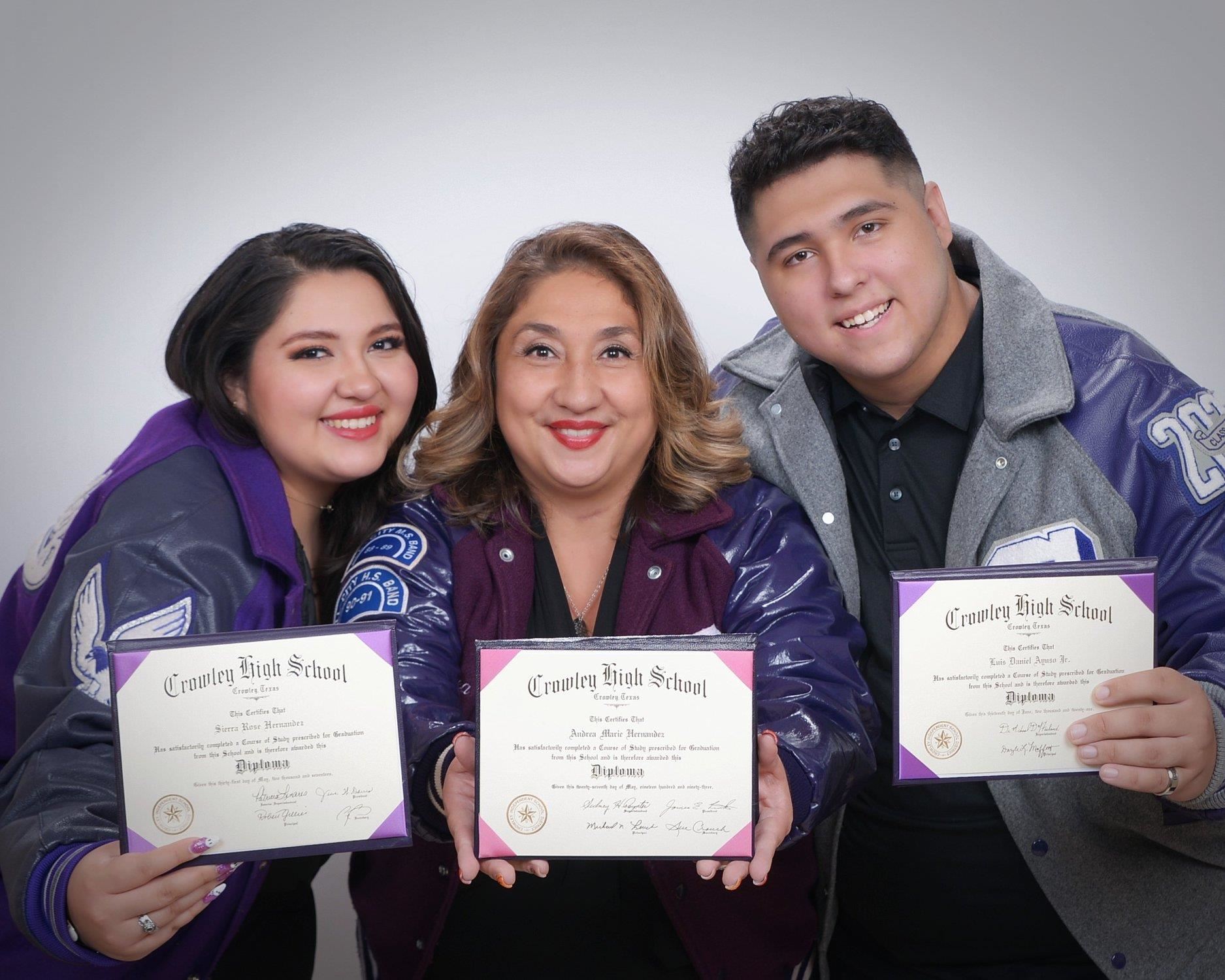 Ayuso family wearing letter jackets with diplomas